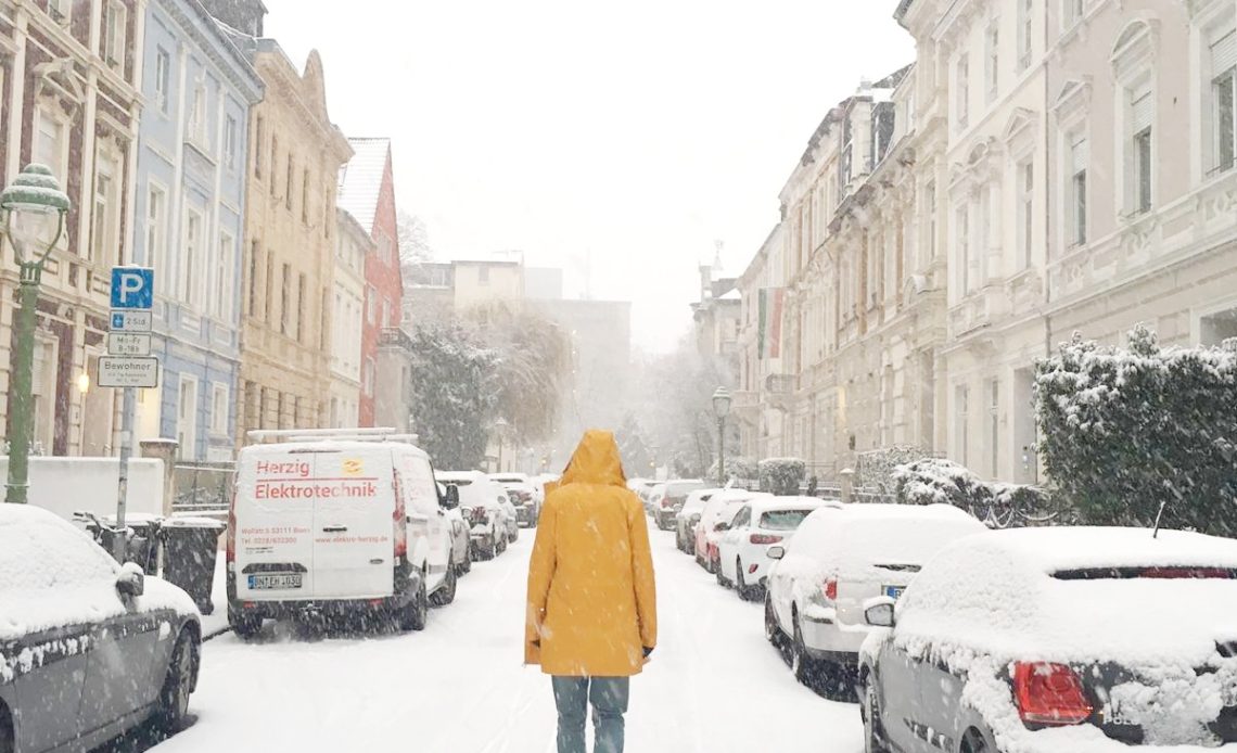 Yellow coat in snow - johnthego.com